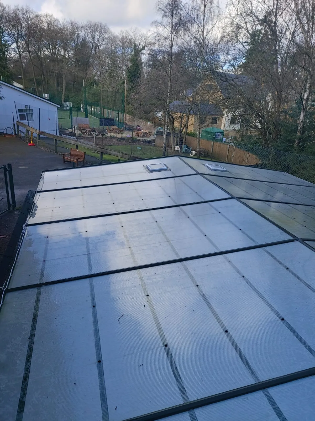 A flat roof is being installed on a house.
