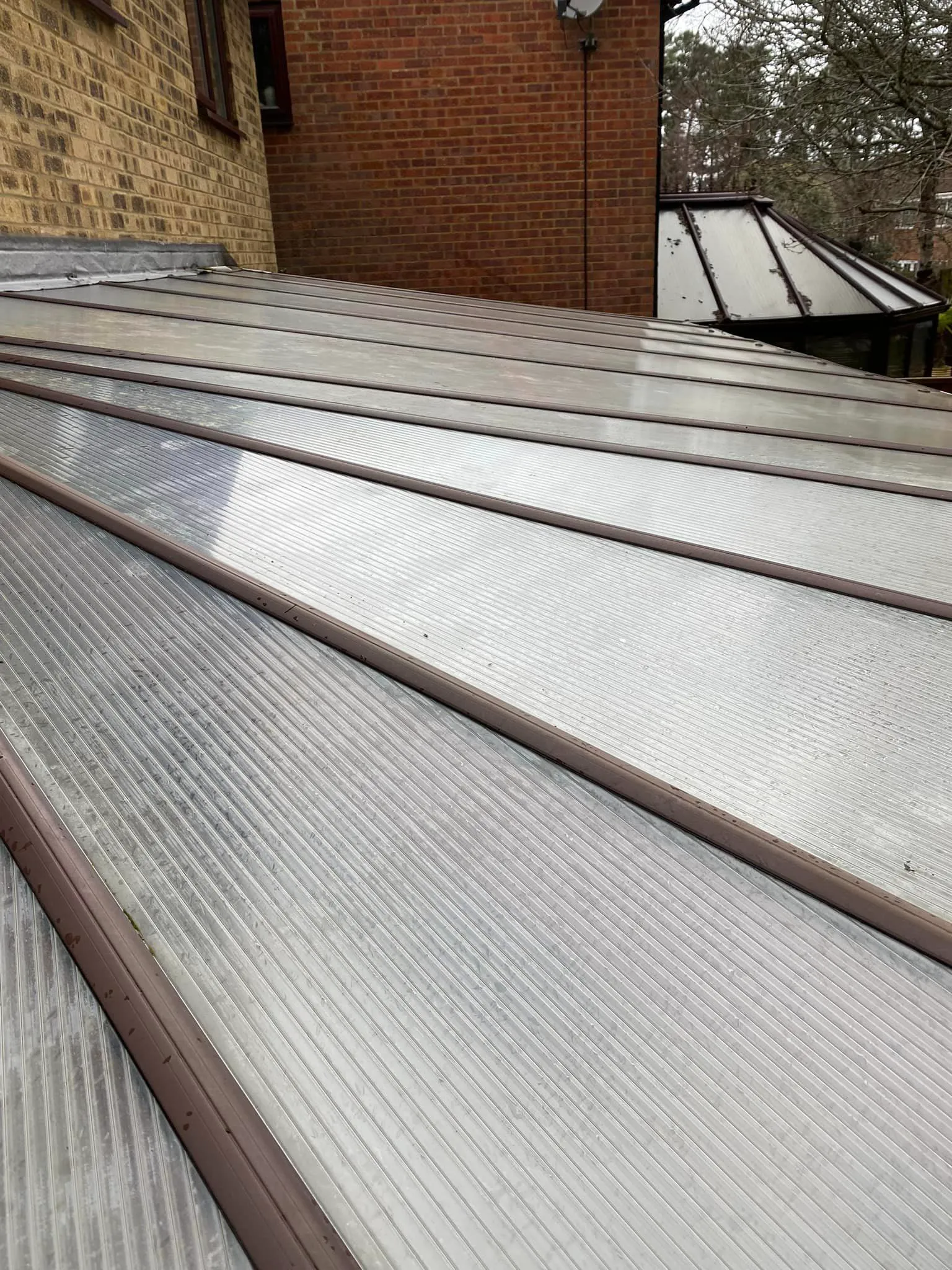 A set of metal steps leading up to a brick building.